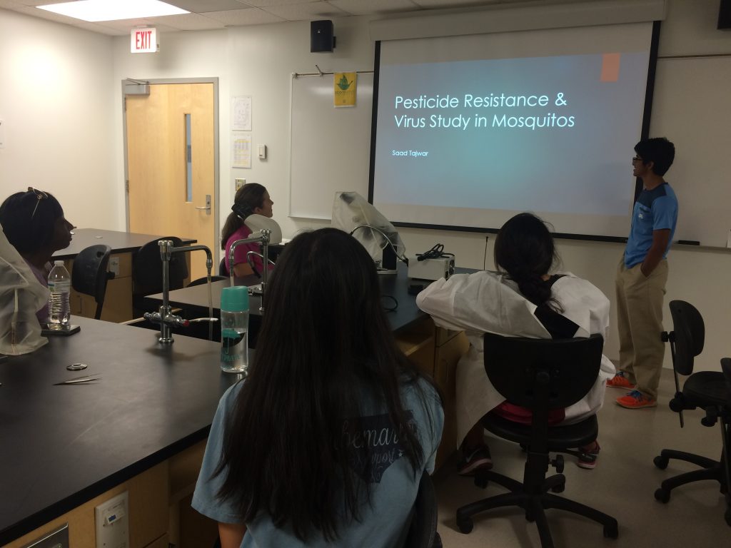 Saad Tajwar, a high school volunteer, giving a presentation on his summer research experience, August 22, 2016 
