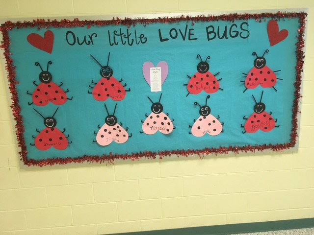 Picture shows bulletin board with student made Love Bug glyphs.