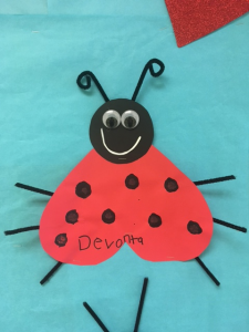 Picture shows Devonta's glyph - which is red, has curled antennaes, straight legs, big eyes, and 8 spots. 